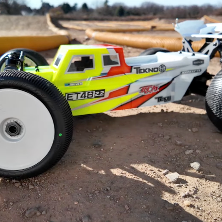 Tekno ET48 2.2 1/8 scale electric truggy on a dirt RC track