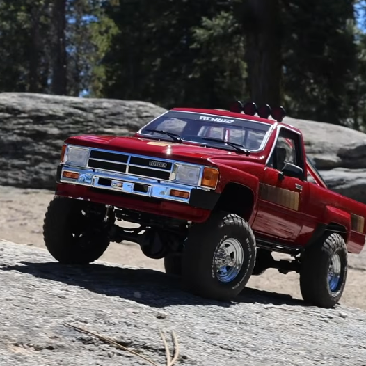 RC4WD Trail Finder 2 1985 Toyota Pickup RTR red scale trail truck with leaf spring chassis and quick-release body mount