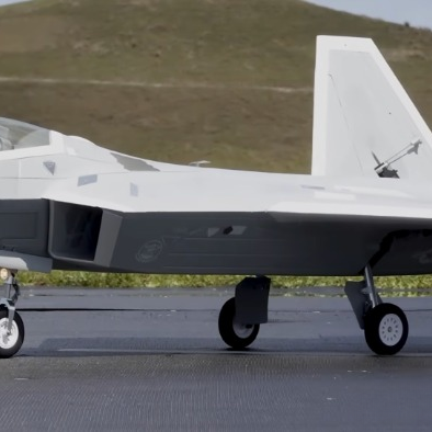 Freewing F22 Raptor V2 90mm EDF review cover image showing side profile on runway with gear down