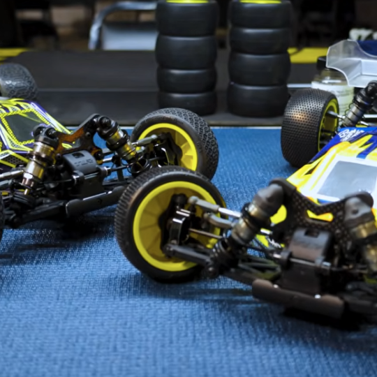 TLR 22X-4 2.0 AC and DC 1/10 4WD buggy chassis on high-grip track surface