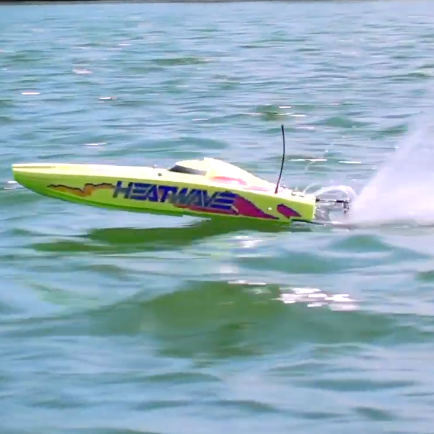 Proboat Blackjack 24 V2 Heat Wave brushless catamaran making a high-speed pass across open water