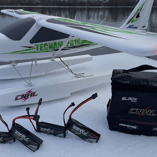 Arrows Tecnam 2010 1450mm RC airplane with floats and 3S LiPo batteries displayed during a calm winter flying session