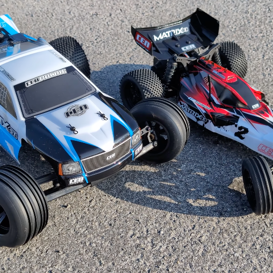 CEN Racing Matrix-E 1/10 2WD Buggy and Matrix Stadium Truck shown together outdoors