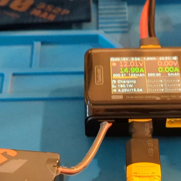 ToolkitRC M6D dual smart LiPo charger in‑use screenshot, display showing 180.1‑watt charging power for lithium‑polymer battery, XT60 connector
