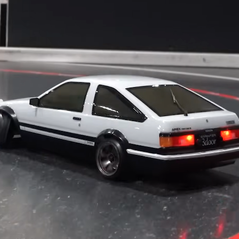 Kyosho Fazer D2 AE86 Sprinter Trueno drifting on indoor RC track, showcasing RWD chassis performance