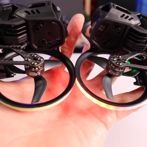 Side-by-side comparison of BETAFPV Pavo20 Pro (left) and Pavo20 Pro II (right), showing updated frame design, ducts and RGB lighting differences.