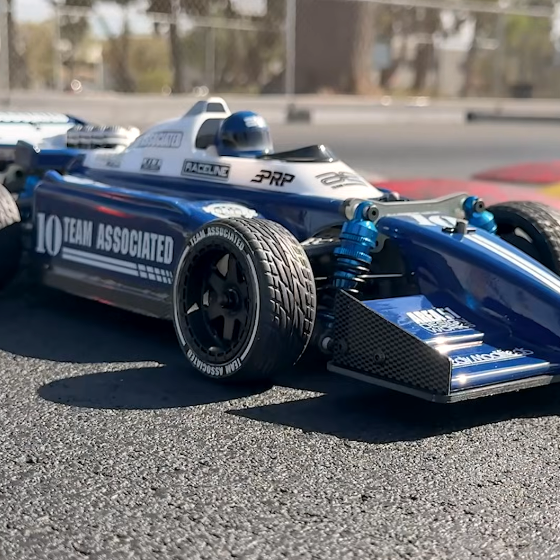 Team Associated RC10 6x6 Formula-style race car showing its two-front four-rear six-wheel layout