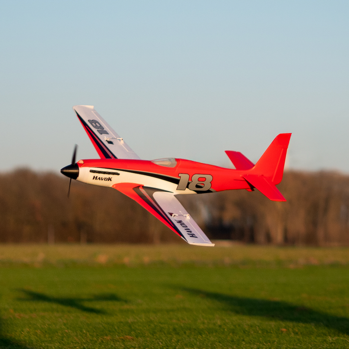CNHL Havok 1000mm RC sport racer performing a high-speed low pass