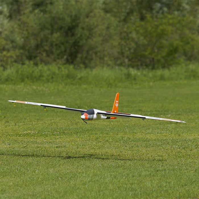CNHL KAVAN Pulse 2200 V2 orange RC sport glider on grass runway
