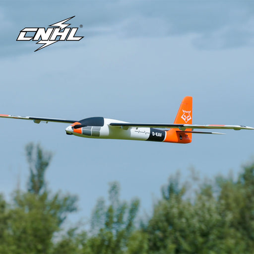 CNHL KAVAN Pulse 2200 V2 2206mm PNP RC electric sport glider in orange flying low over grass