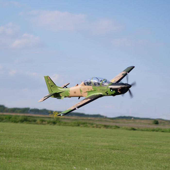 CNHL Super Tucano V2 making a low banking pass over the flying field