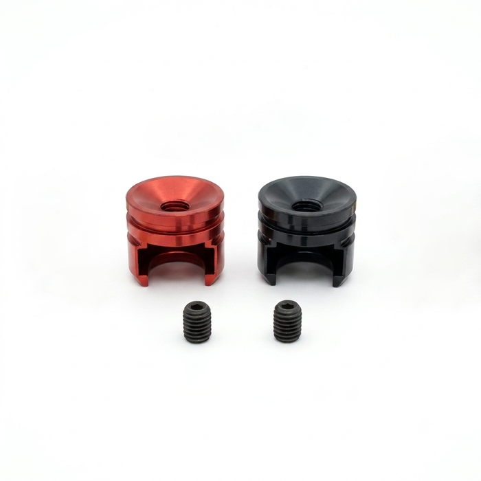 Close-up of red and black 5mm heatsink bullet plug grips with set screws for RC racing battery leads.