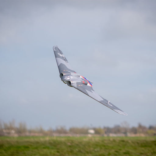 CNHL AviNationRC Horten Ho 229 RC plane in flight low over grass field
