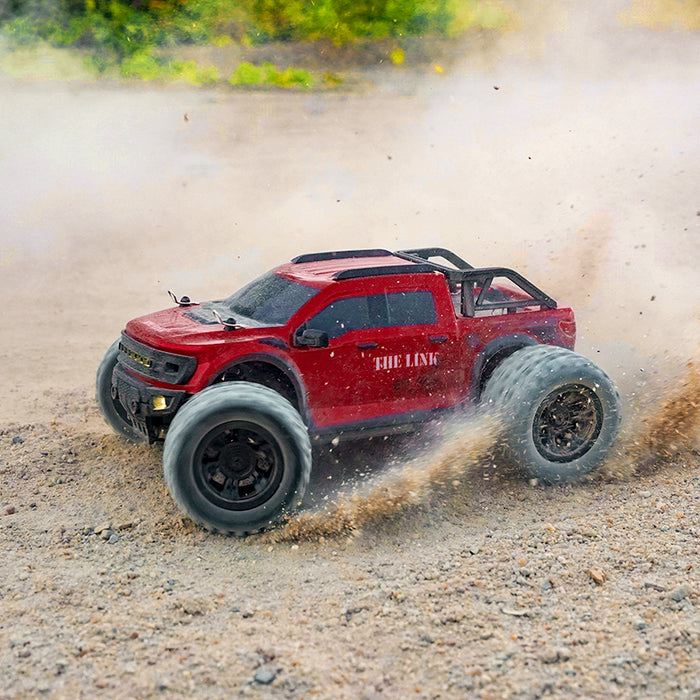 SCY 18102 1/12 scale off-road monster truck driving on sand and gravel