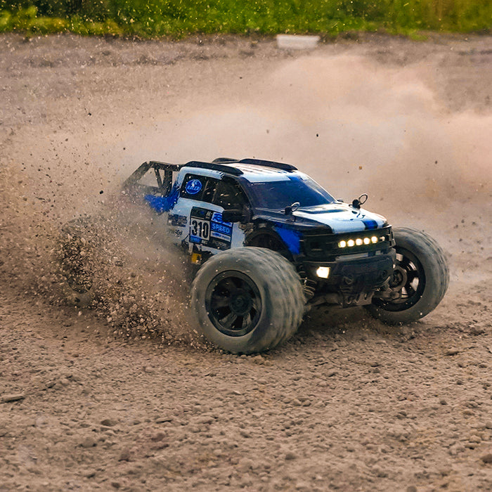 SCY 18102 blue version off-road monster truck drifting on dirt