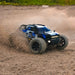 SCY 18102 blue version off-road monster truck drifting on dirt
