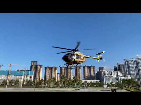 RC ERA MD500 C189 brushless flybarless RC helicopter outdoor flight test hovering over city skyline